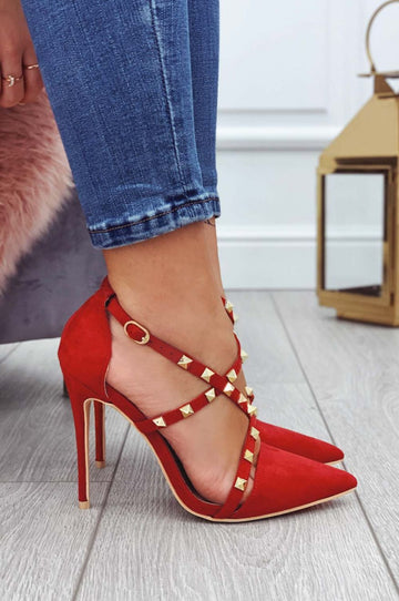 Red suede pumps with gold studs and high heel