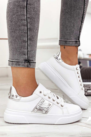 White sneakers with silver inserts and studs