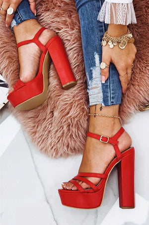 Red faux leather sandals with high heels