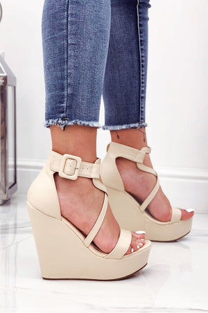 Beige faux leather wedge sandals