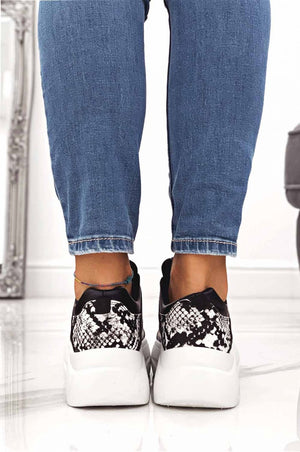 Black sneakers with python-effect inserts and laces