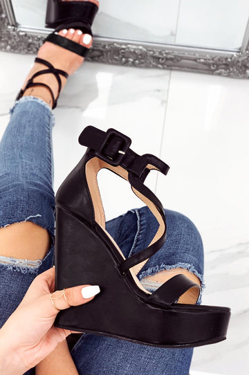 Black faux leather wedge sandals