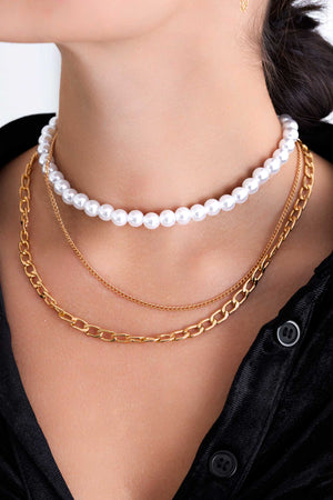 Layered necklace with gold chain and pearls
