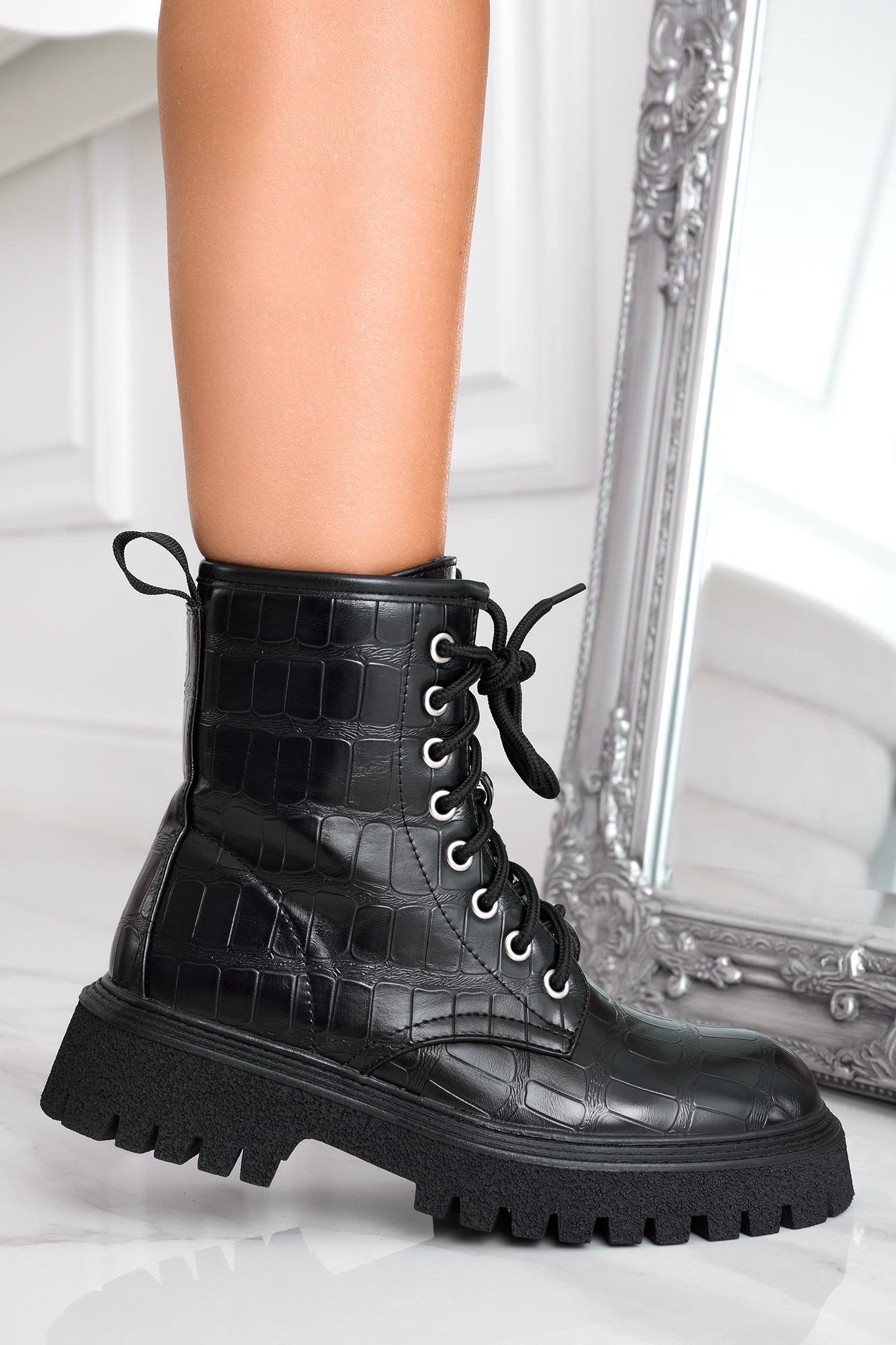 Black crocodile-effect combat ankle boots