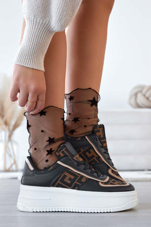 Black sneakers with patterned fabric inserts