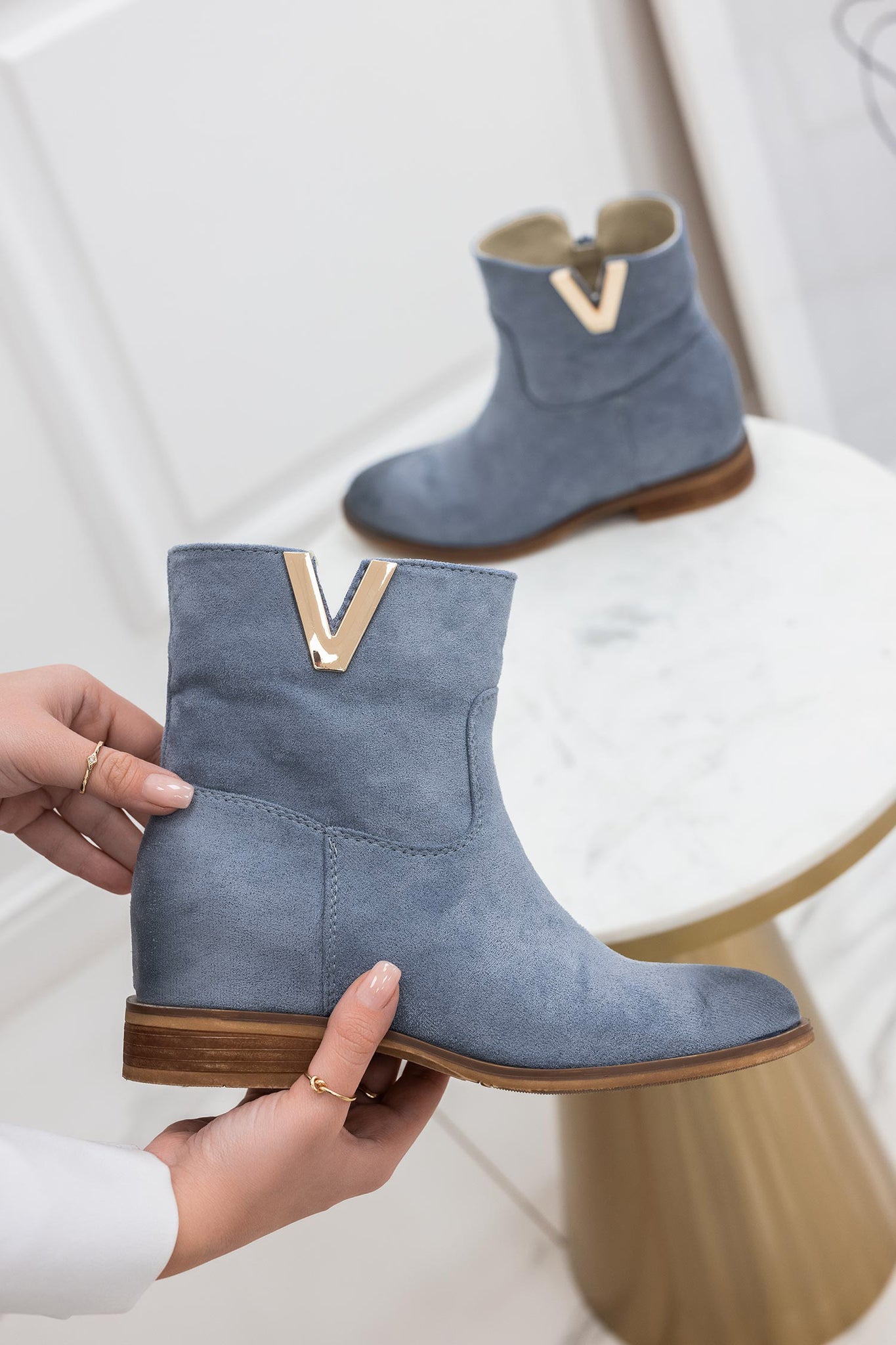 Blue suede ankle boots with internal wedge