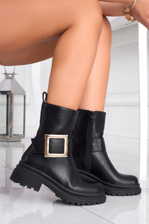 Black ankle boots with gold buckle
