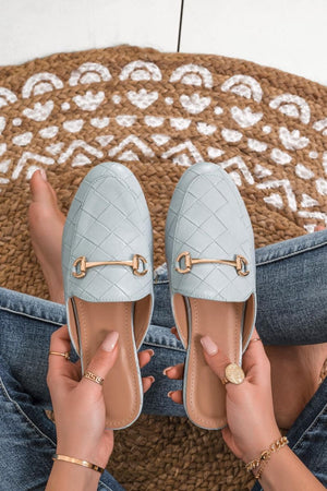 blue loafers with open back and checkered pattern